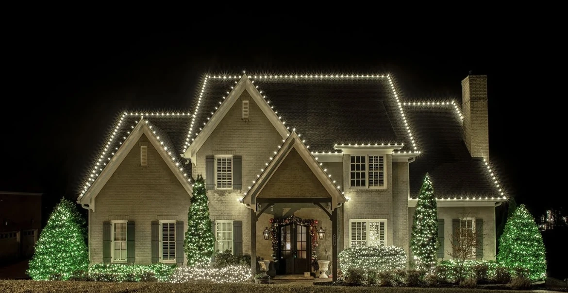 Holiday lights on a Flour Bluff home with a lit roofline in Corpus Christi