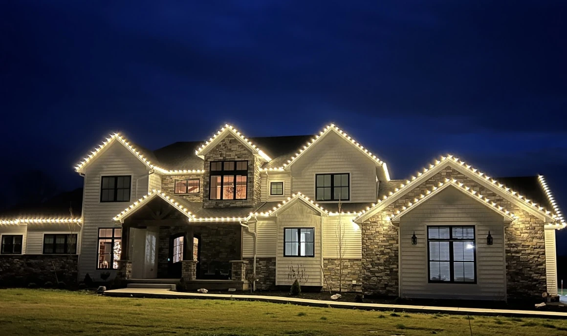 Warm white Christmas lights outlining a two-story home on Ocean Drive in Corpus Christi