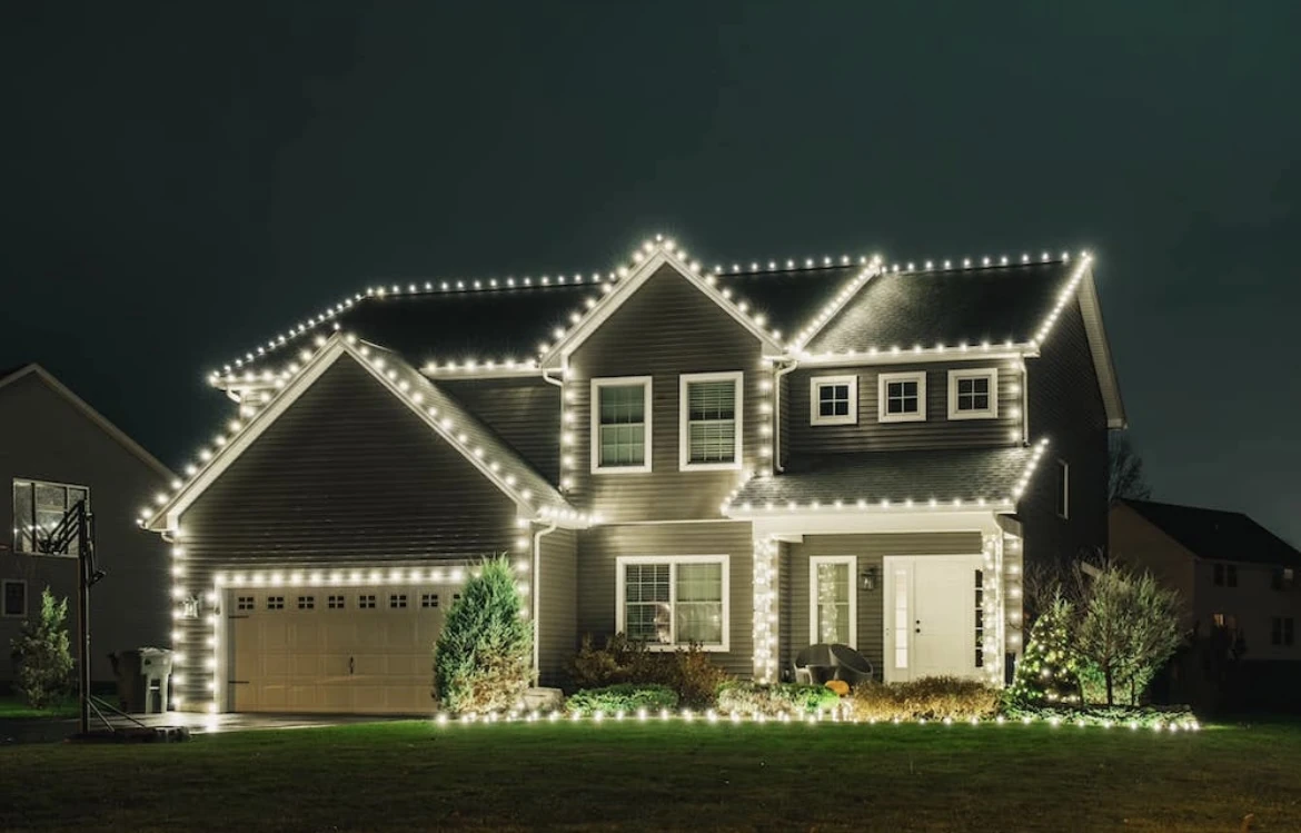 Professional holiday lighting on a Padre Island home in Corpus Christi at dusk